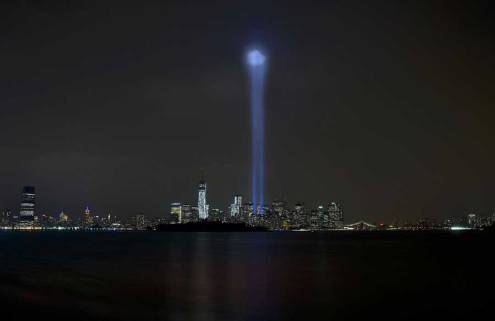 New York City’s lower Manhattan skyline and the newly completed One World Trade Center Building are illuminated by two beams of light representing the remembrance of the American citizens lost Sept. 11, 2001. Photo by David Tucker, courtesy of U.S. Air Force.
